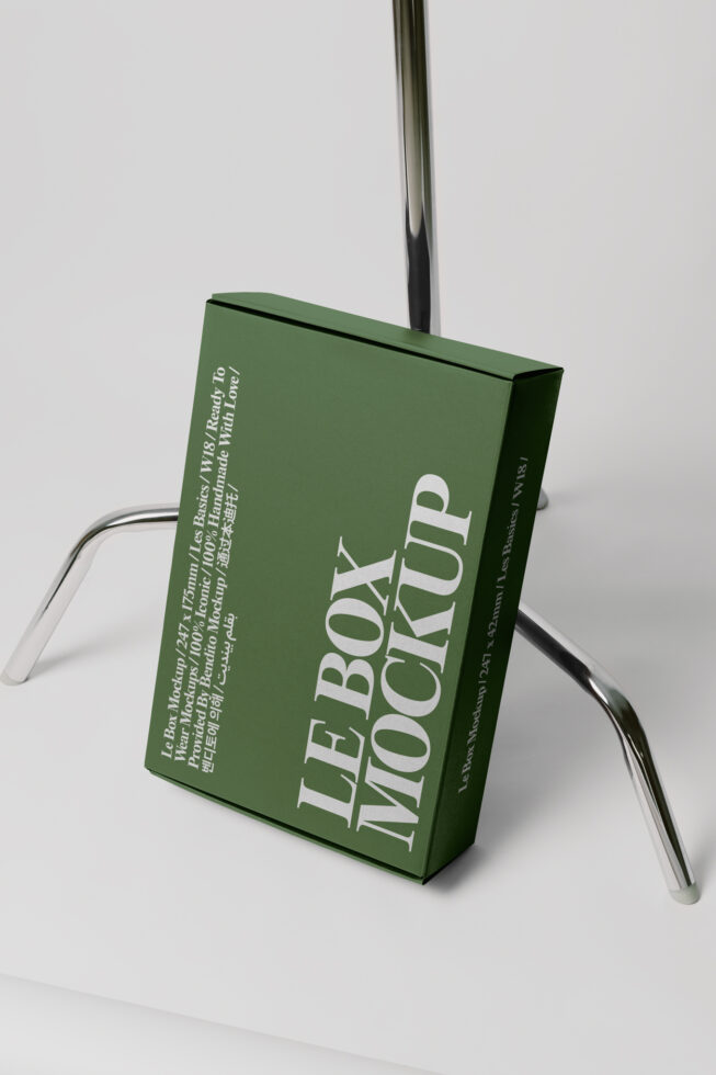 Green box mockup 247x175mm hanging on steel wire against white backdrop