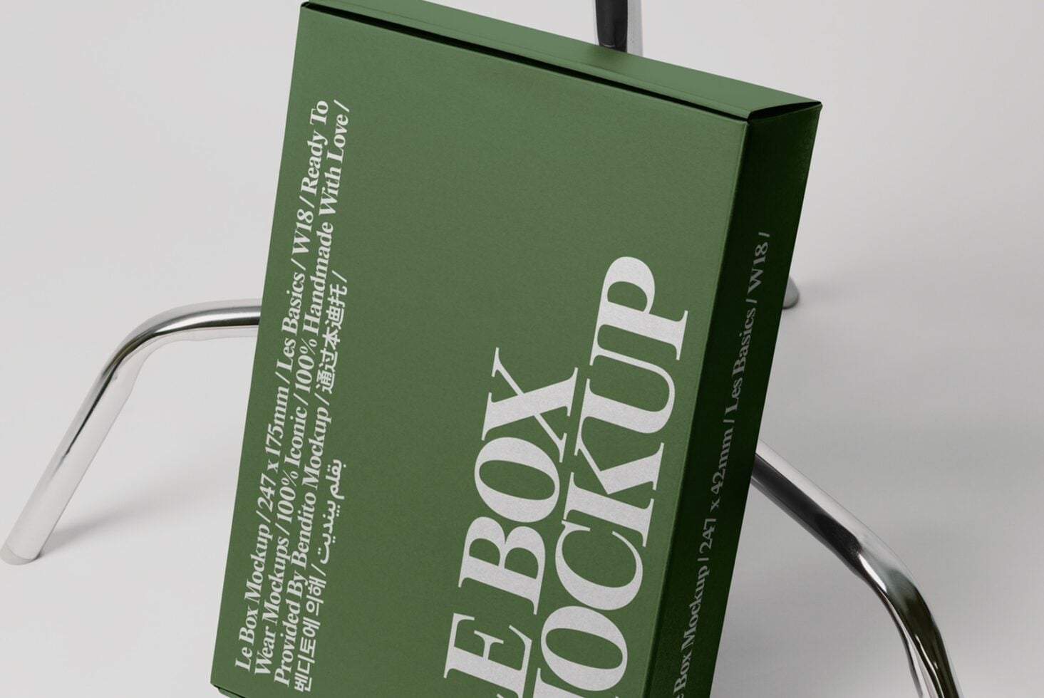 Green box mockup 247x175mm with multilingual text on steel wire display