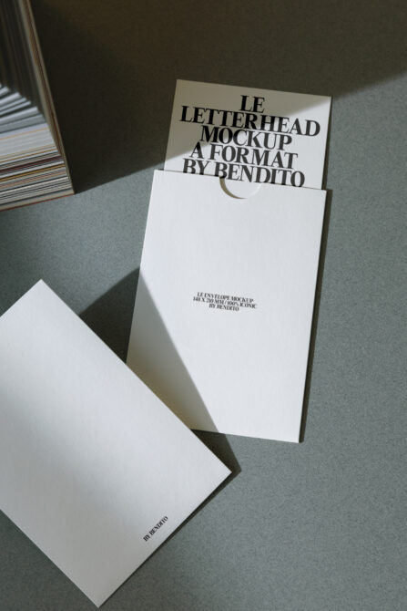 White envelope mockup with cream letterhead peeking out inside folder