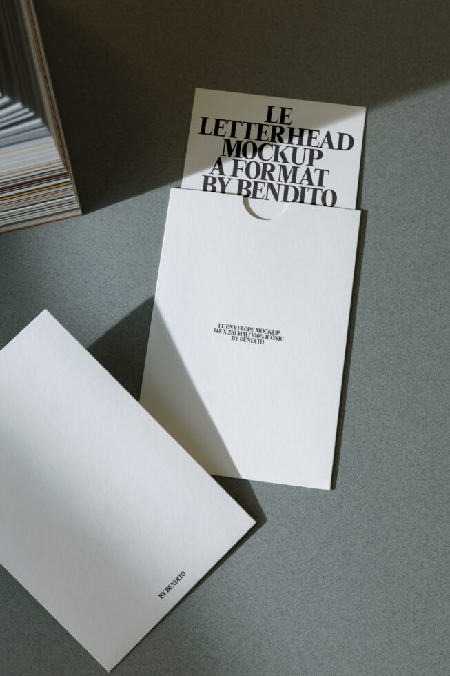 White envelope mockup with cream letterhead peeking out inside folder