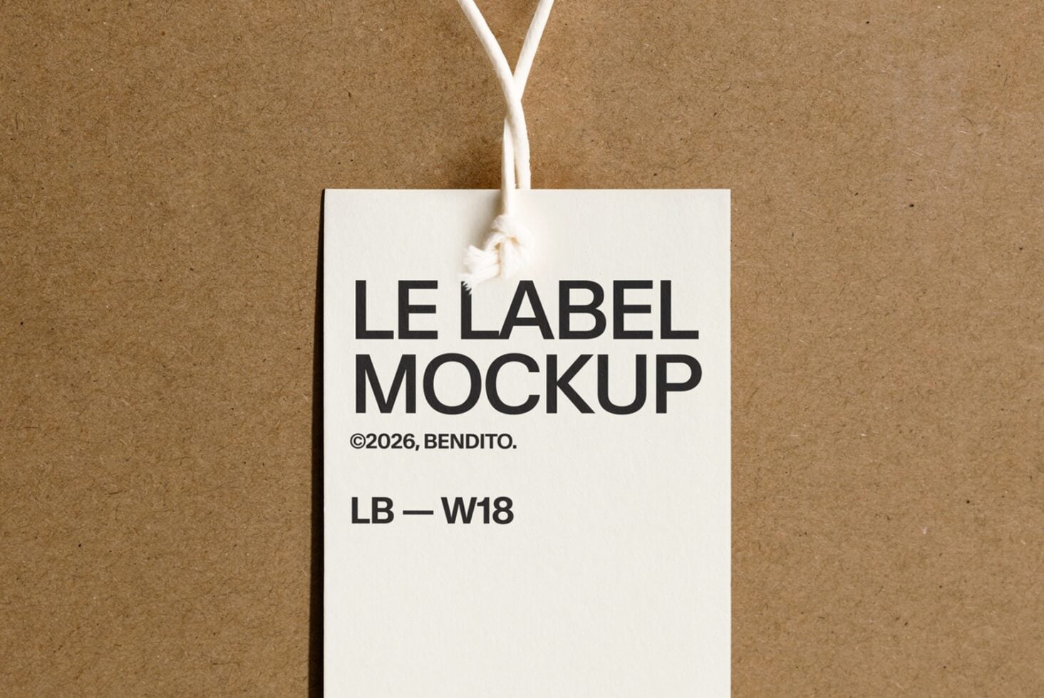 White rectangular hang tag with black text on kraft paper background