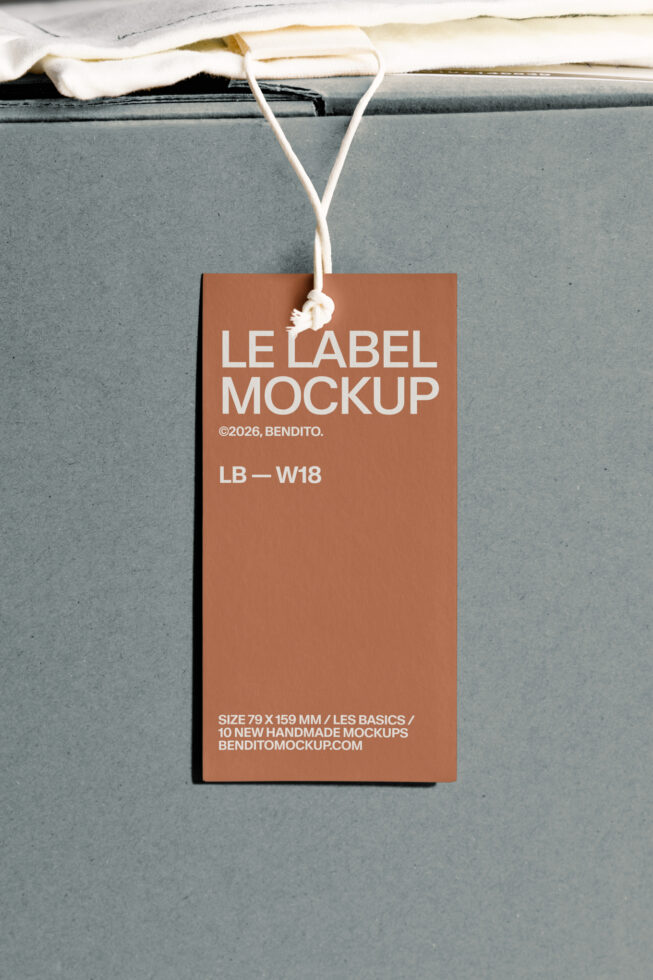 Terracotta colored hang tag with white text tied to gray cardboard box