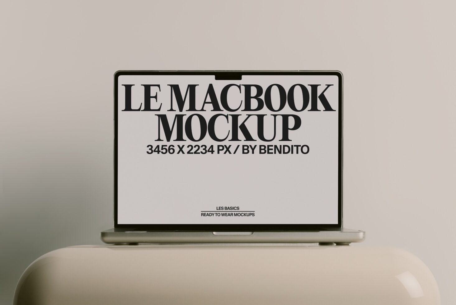 Silver MacBook Pro showing minimalist black text mockup on white screen