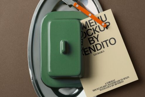 Green container on oval metal tray with orange knife, cream label attached