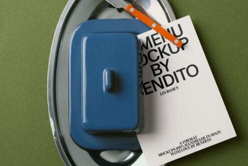 Blue container on oval metal tray with orange knife, cream label attached