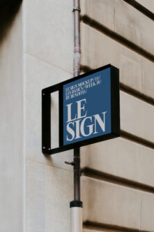 Street sign mockup mounted on pole with blue background, white serif lettering