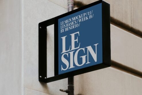 Street sign mockup mounted on pole with navy background, cream serif lettering
