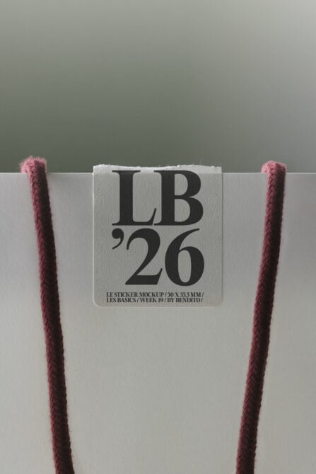 Rounded square sticker mockup on cream paper with mauve rope corners