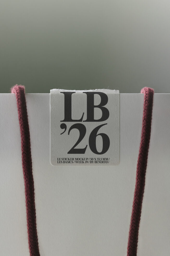 Rounded square sticker mockup on cream paper with mauve rope corners