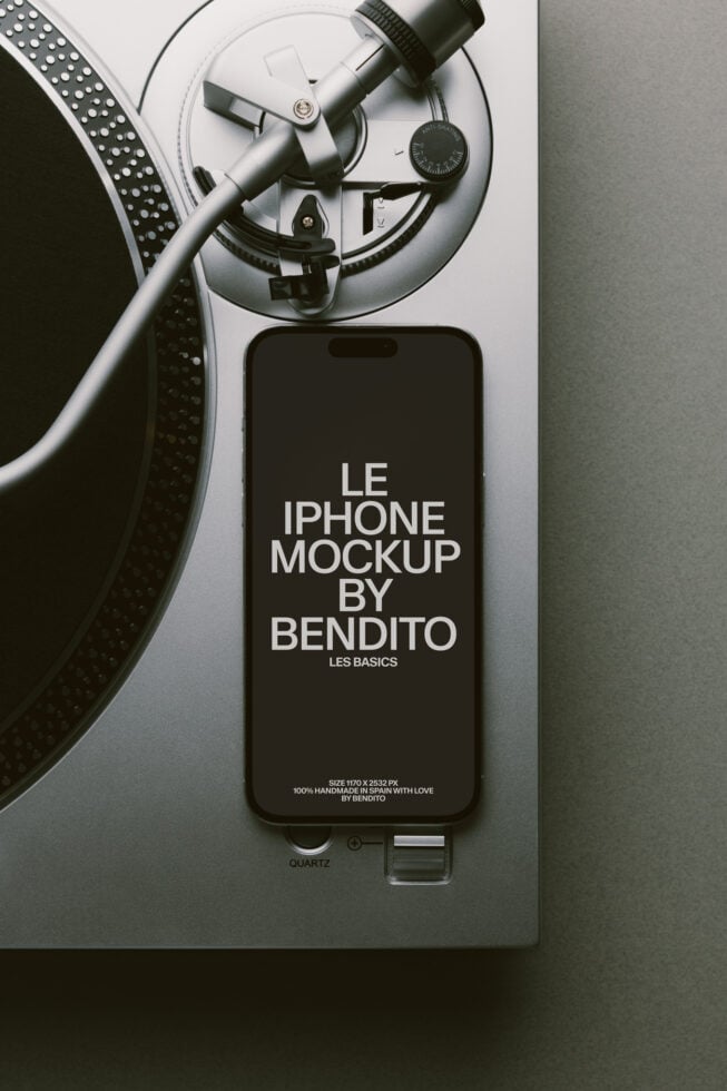 Black iPhone next to turntable with vinyl record mockup