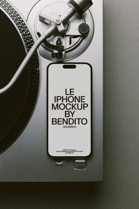 White iPhone next to turntable with vinyl record mockup