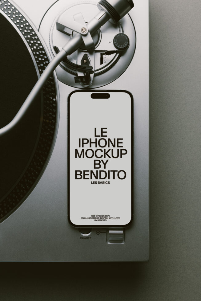 White iPhone next to turntable with vinyl record mockup