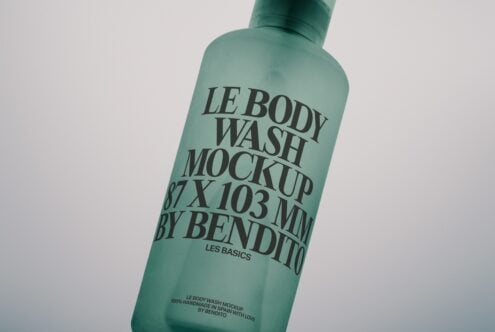 Frosted mint green body wash bottle angled with serif typography on label