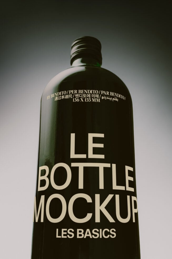 Dark glass bottle mockup with cream typography showing multilingual text