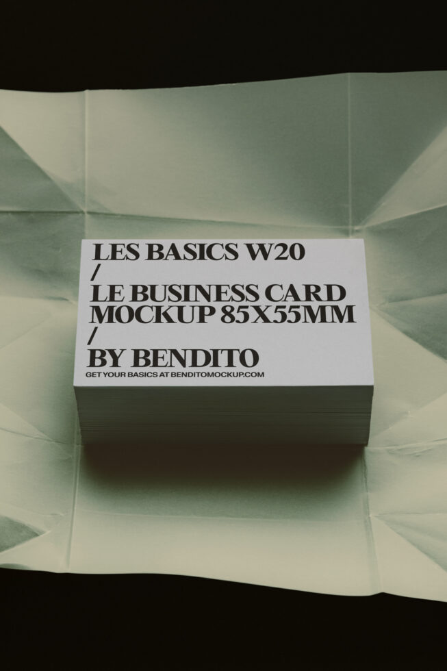 Stack of business cards with white label on sage green background mockup