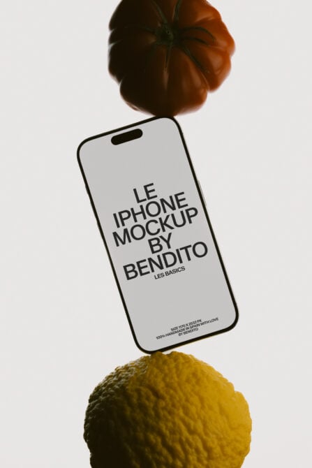 iPhone mockup floating between tomato, lemon with warm studio lighting