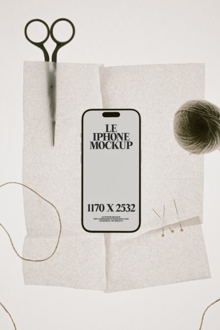iPhone mockup on cream paper with scissors, twine, dried flowers