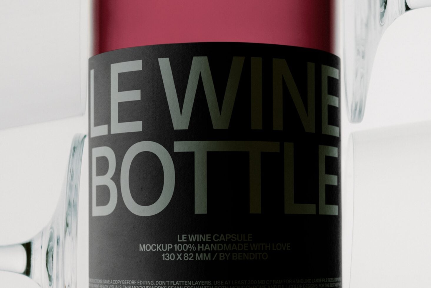 Wine bottle label mockup with burgundy bottle, black wrap label, metallic text, surrounded by glasses