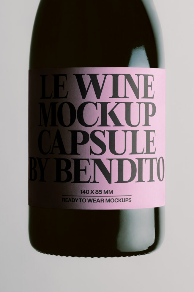 Wine bottle with pink label mockup showing black serif typography on dark glass