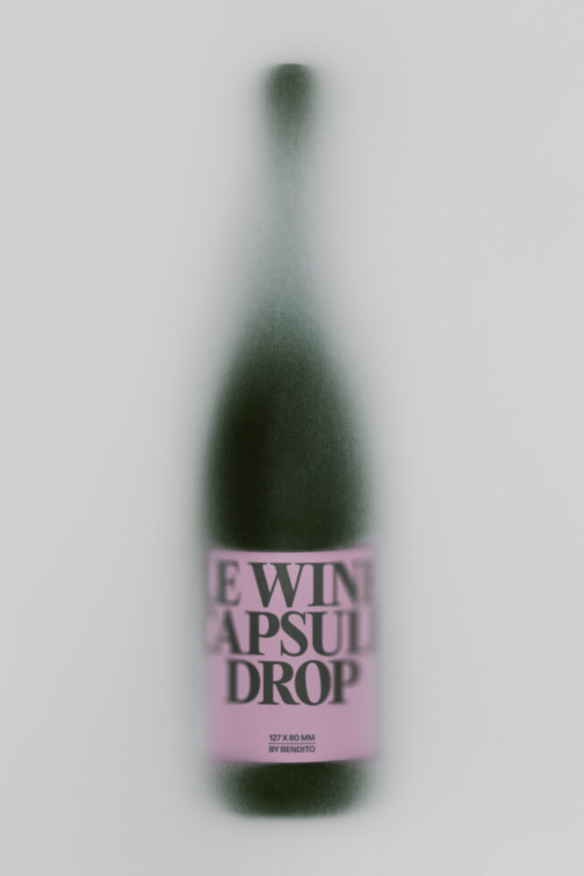 Blurred wine bottle mockup with pink label showing "Ewin Apsuit Drop" branding by Bendito
