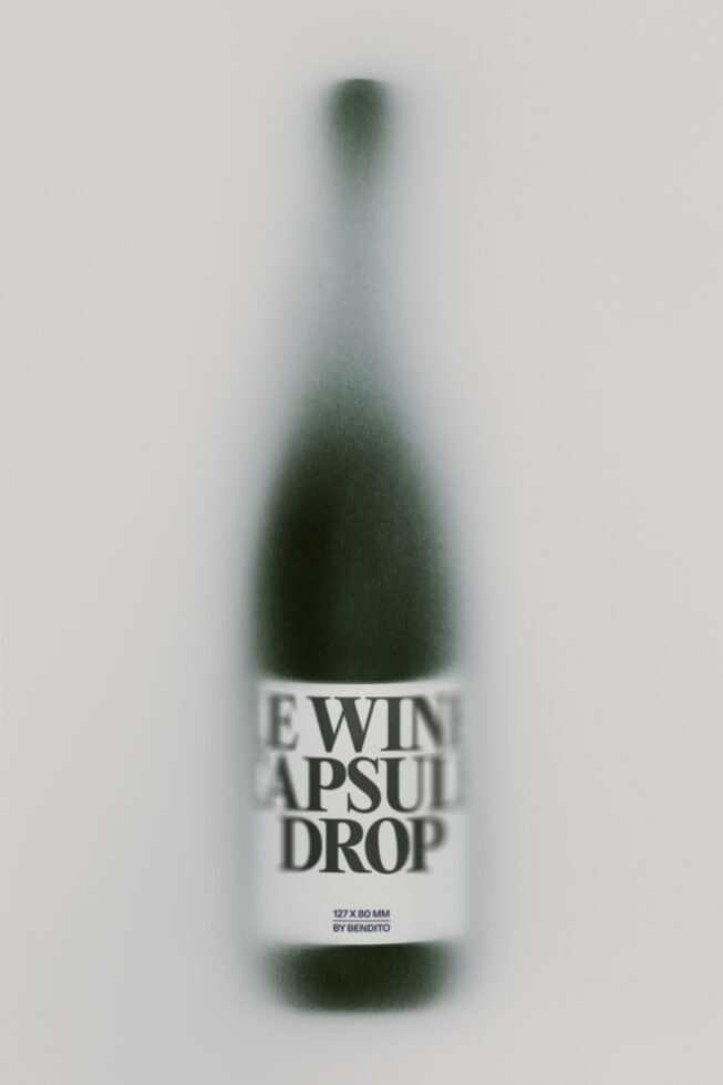 Blurred wine bottle mockup with white label reading "Ewin Apsuit Drop" on neutral background