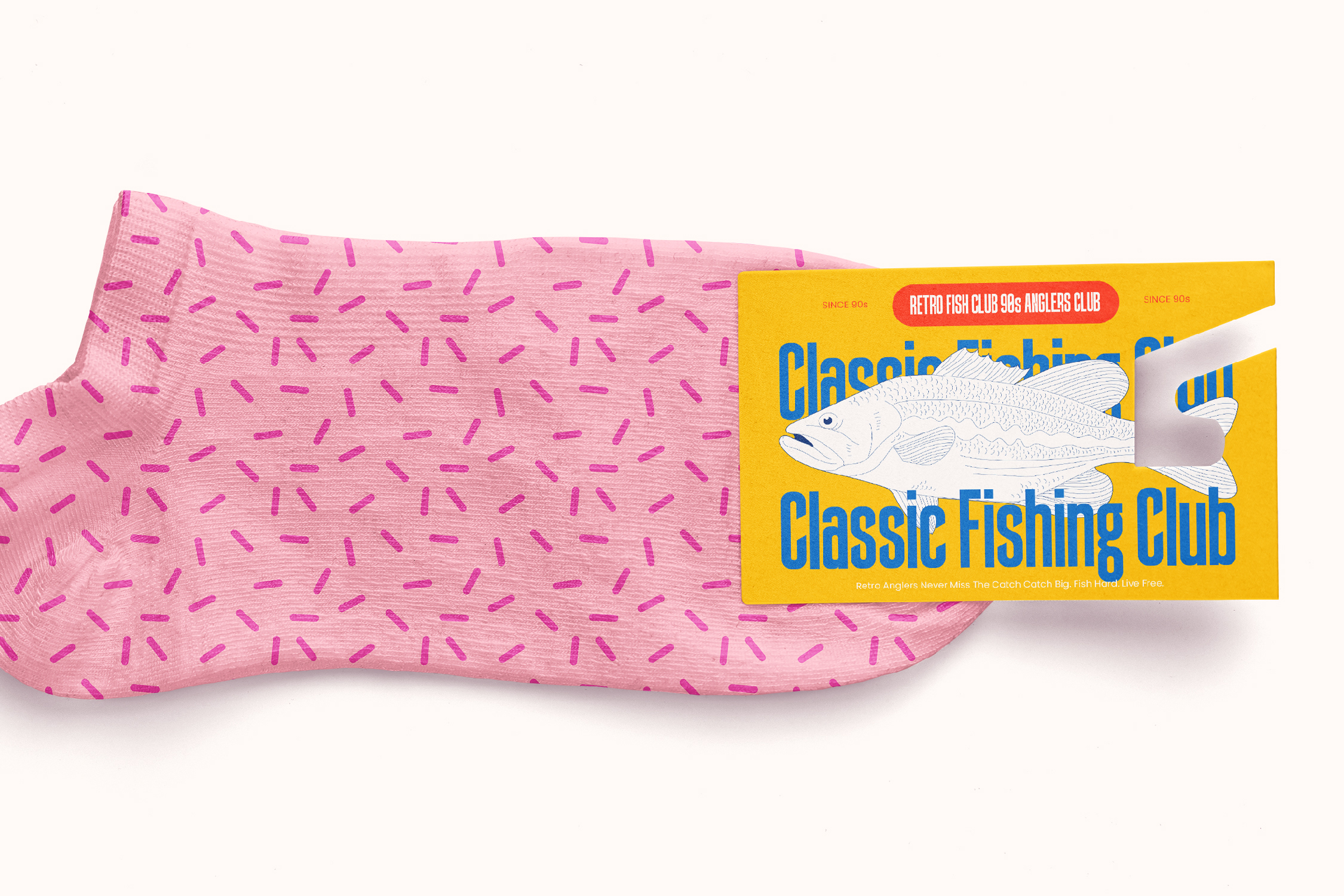 Pink packaged fabric with magenta dashes, yellow label showing retro fishing club