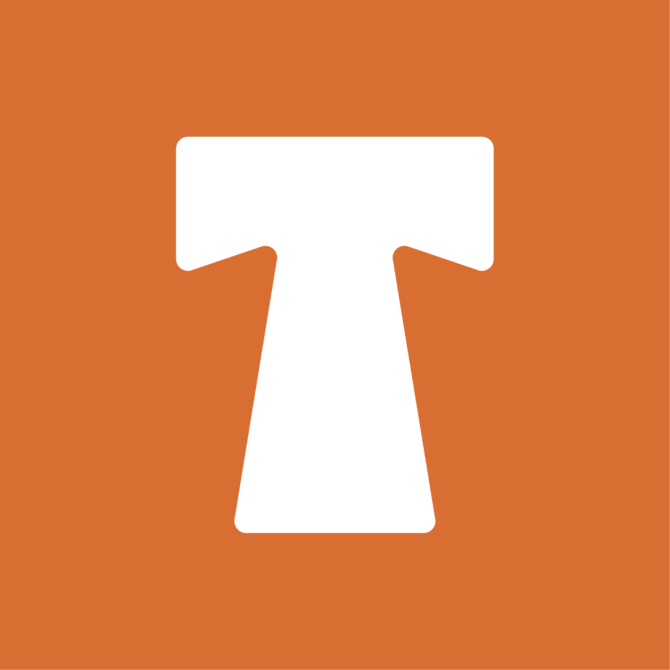 White tshirt mockup displayed on burnt orange background