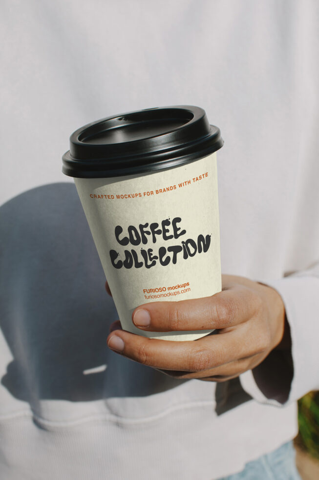 Cream colored disposable coffee cup with black lid, Coffee Collection text in bold font