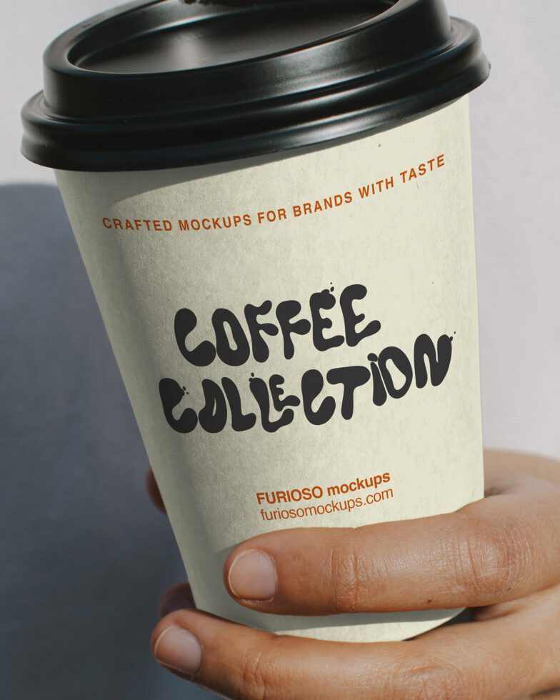 Cream coffee cup with black lid held in two hands, displaying Coffee Collection branding