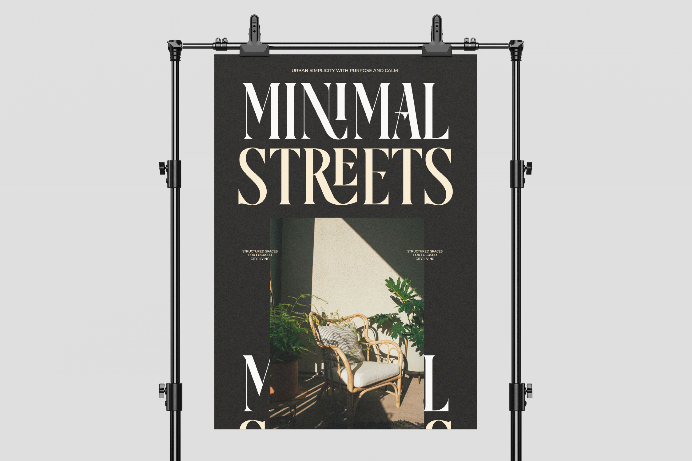 Black poster on industrial stand showing minimal streets magazine with chair photo