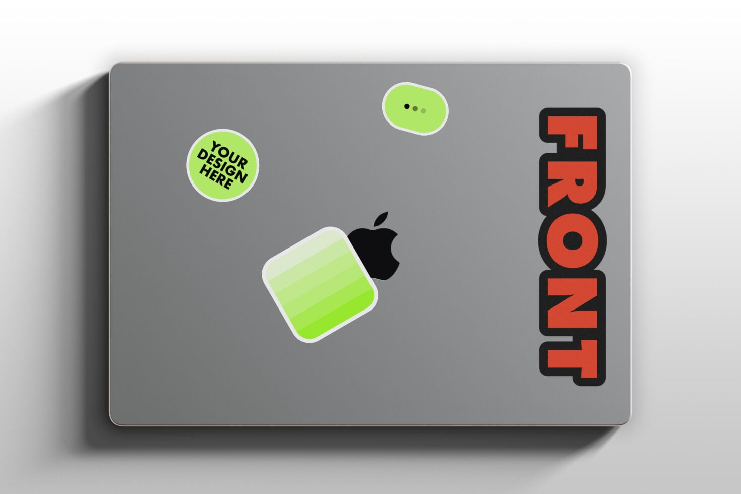 Laptop screen showing green gradient app icon, chat bubble, custom design spot