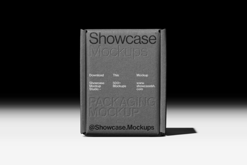 Gray embossed box mockup with Showcase branding on black surface