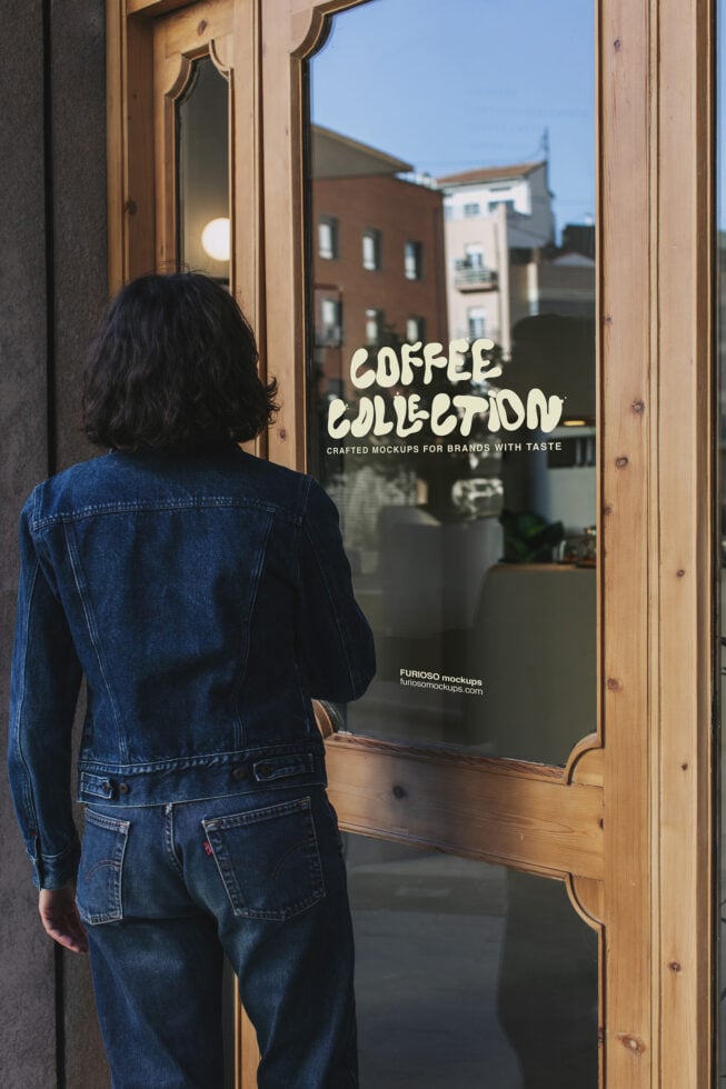 Woman in denim jacket viewing storefront window with cream coffee collection text