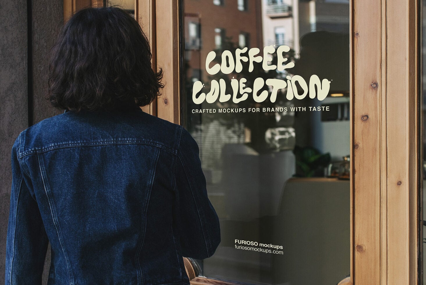 Person looking at shop window displaying cream colored coffee collection lettering
