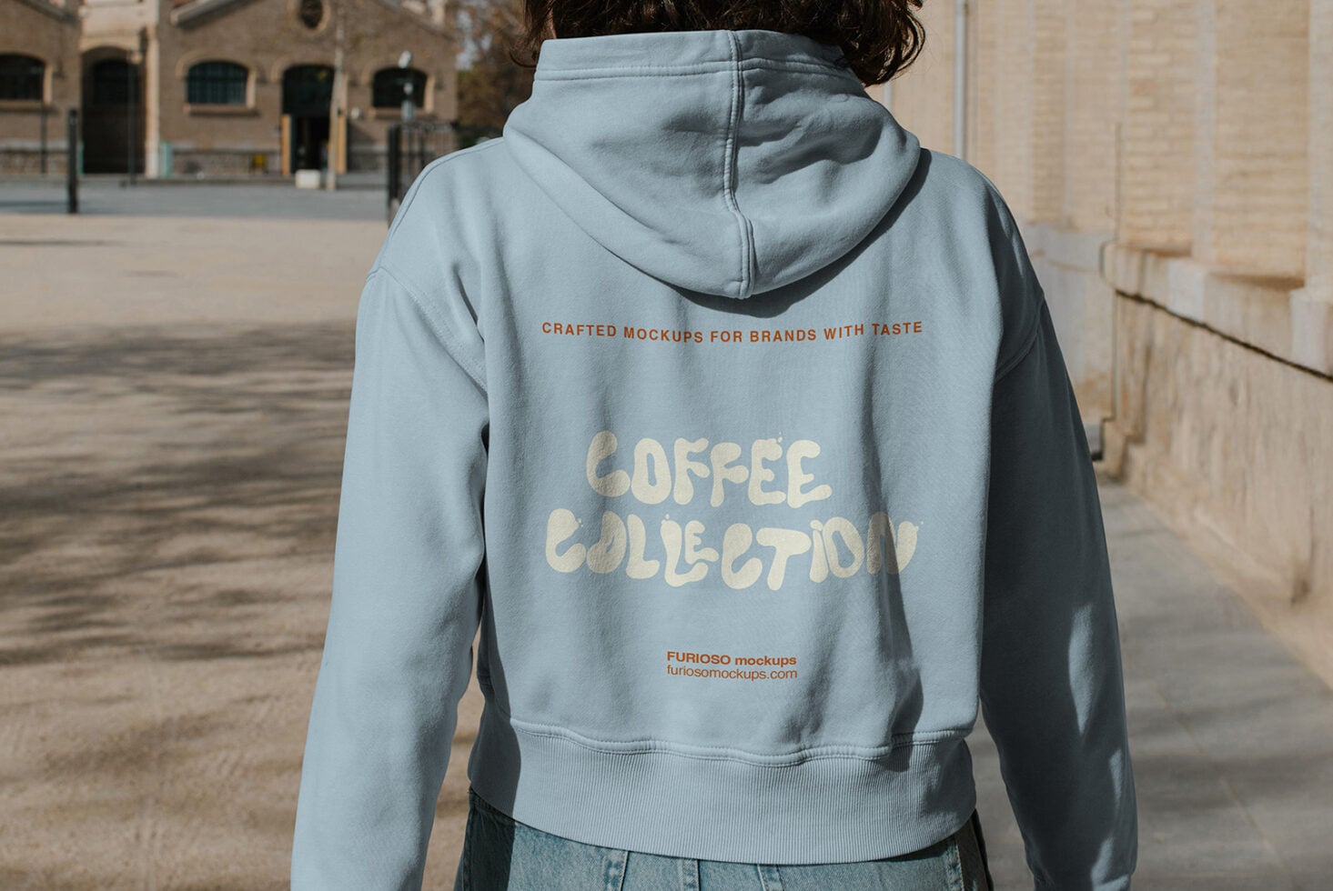 Back view of light blue hoodie with Coffee Collection text print
