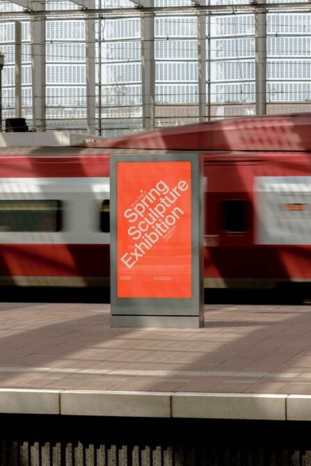 Urban billboard mockup with red train passing behind, bright orange poster display in transit station