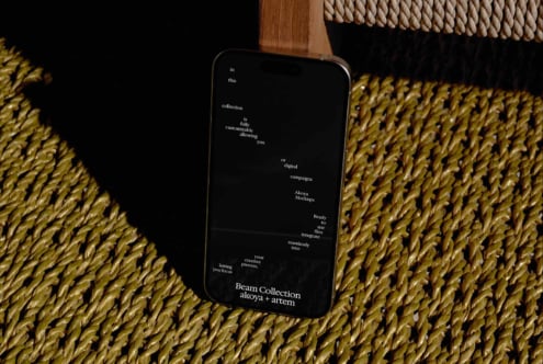 Phone mockup displaying Beam Collection branding on black screen with natural woven textures