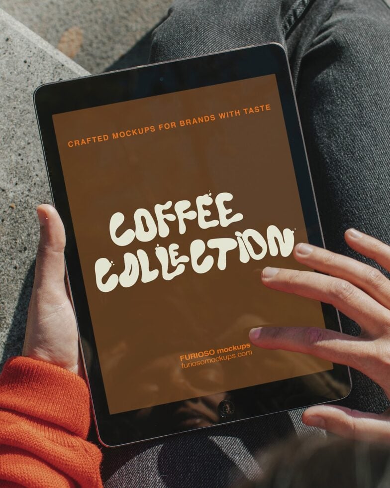 Tablet screen showing coffee collection design held in hands