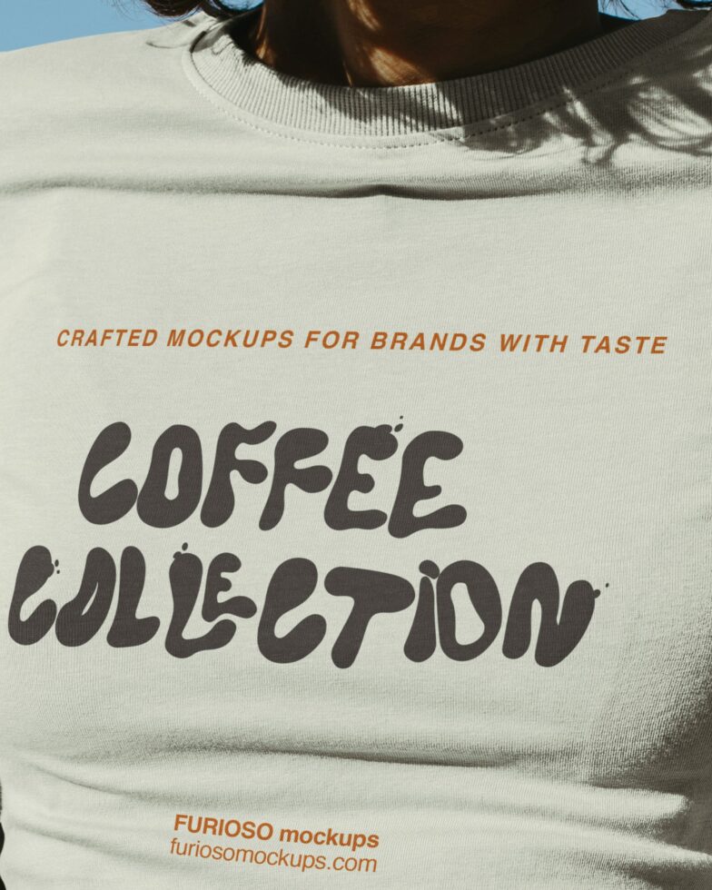 Close up of cream sweatshirt with coffee collection lettering in sunlight