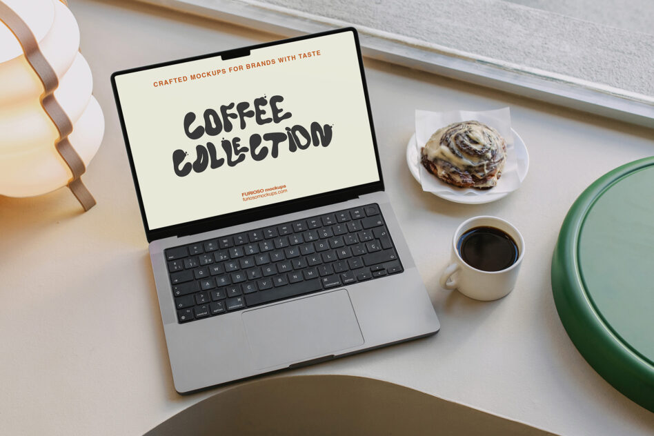 Cream colored laptop screen showing coffee collection design with desk styling