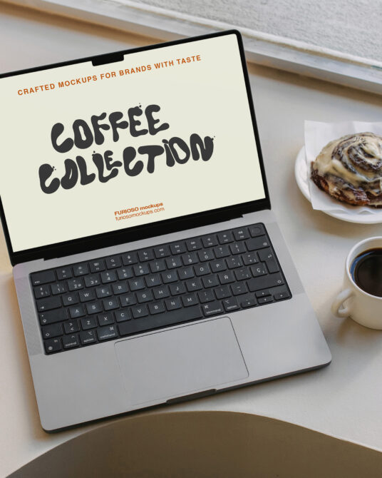 Laptop displaying coffee collection mockup surrounded by cappuccino mug cinnamon roll