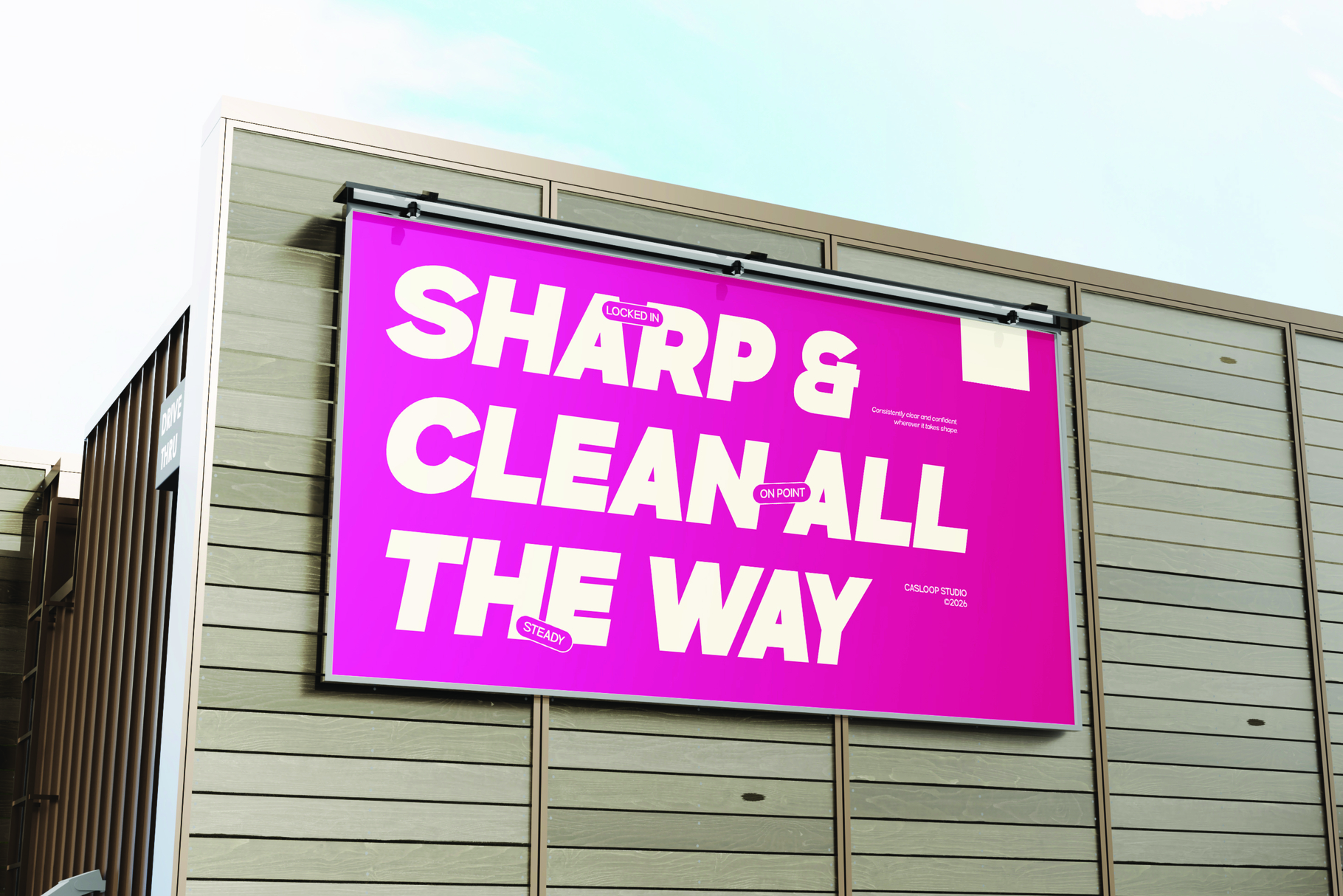 Bright magenta billboard mockup with bold white typography on beige building facade against clear sky