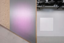 Minimalist gallery showing blank white canvas on clean wall