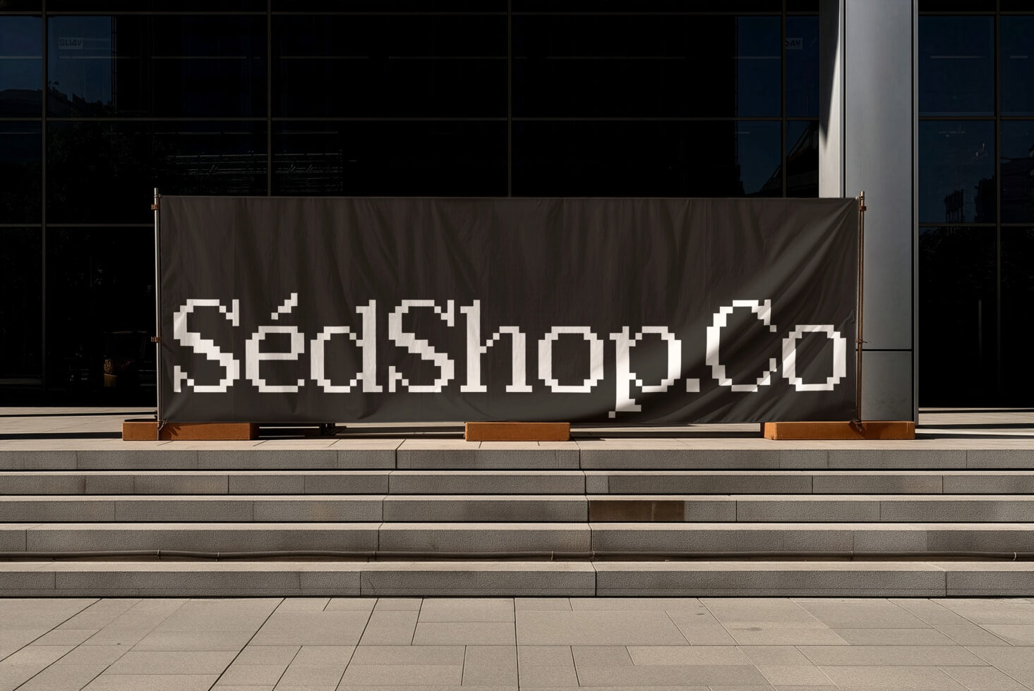 Shop window banner featuring blocky pixelated sans-serif lettering