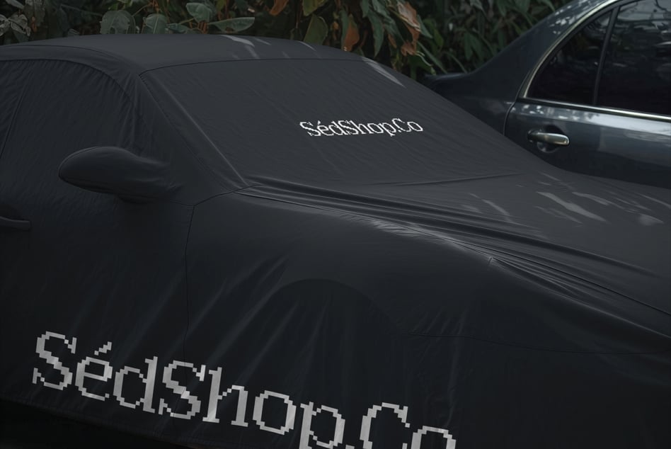 Black car windshield cover mockup with pixelated retro font logo displayed