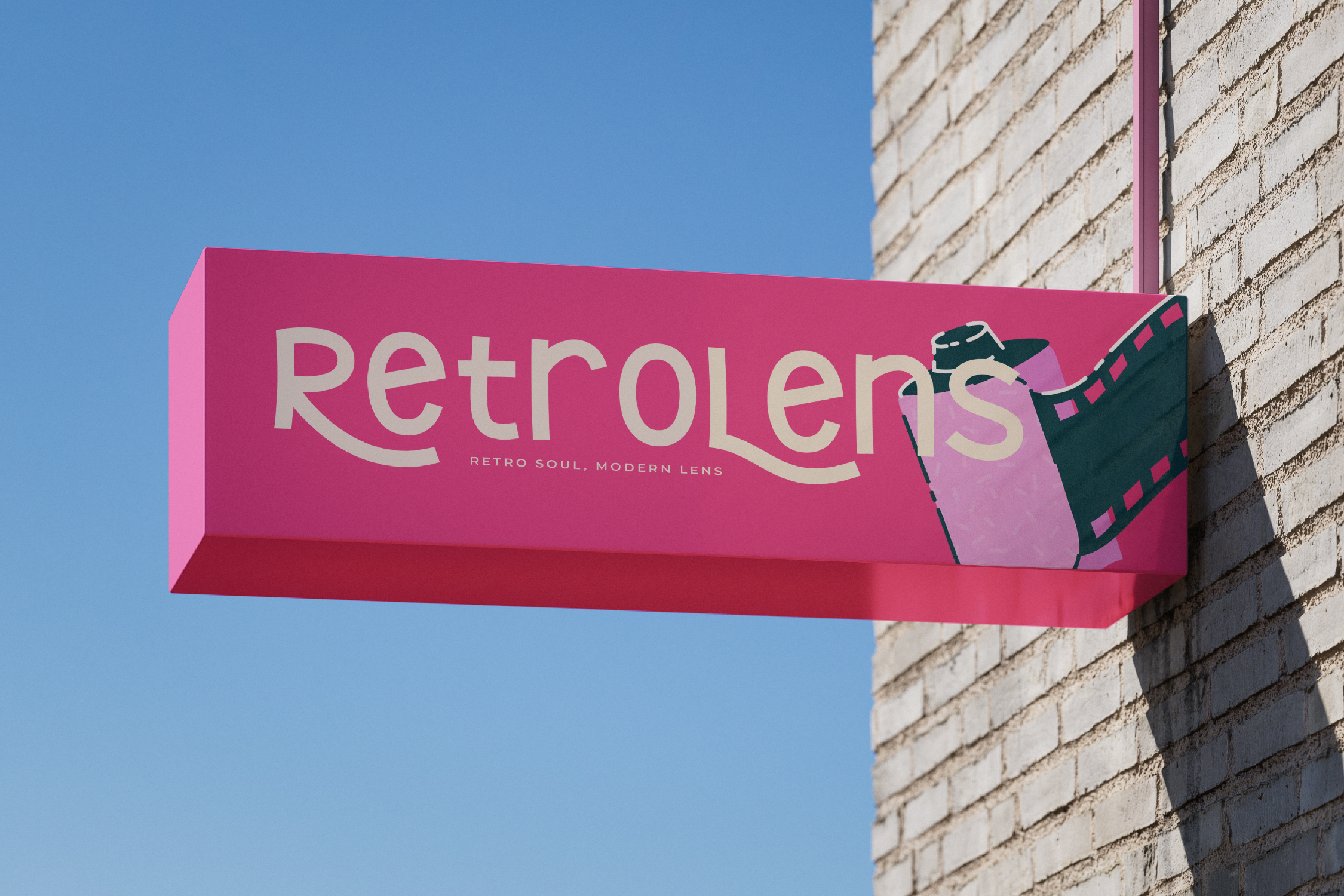 Bright pink storefront sign for Retrolens eyewear with film strip graphic on cream brick wall