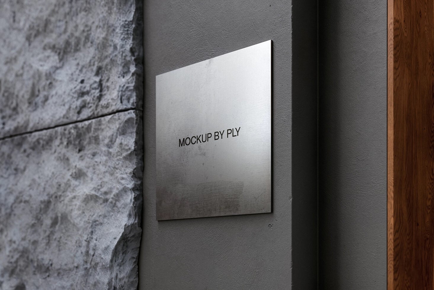 White canvas mounted on textured gray wall between concrete pillar