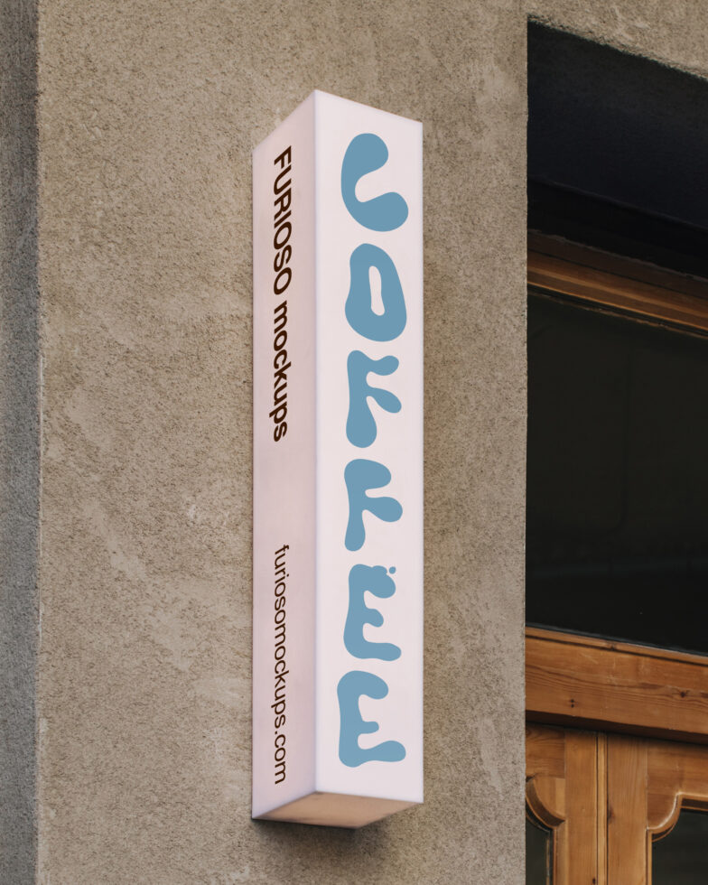 Vertical white box sign with blue rounded letters reading softly hung on concrete wall