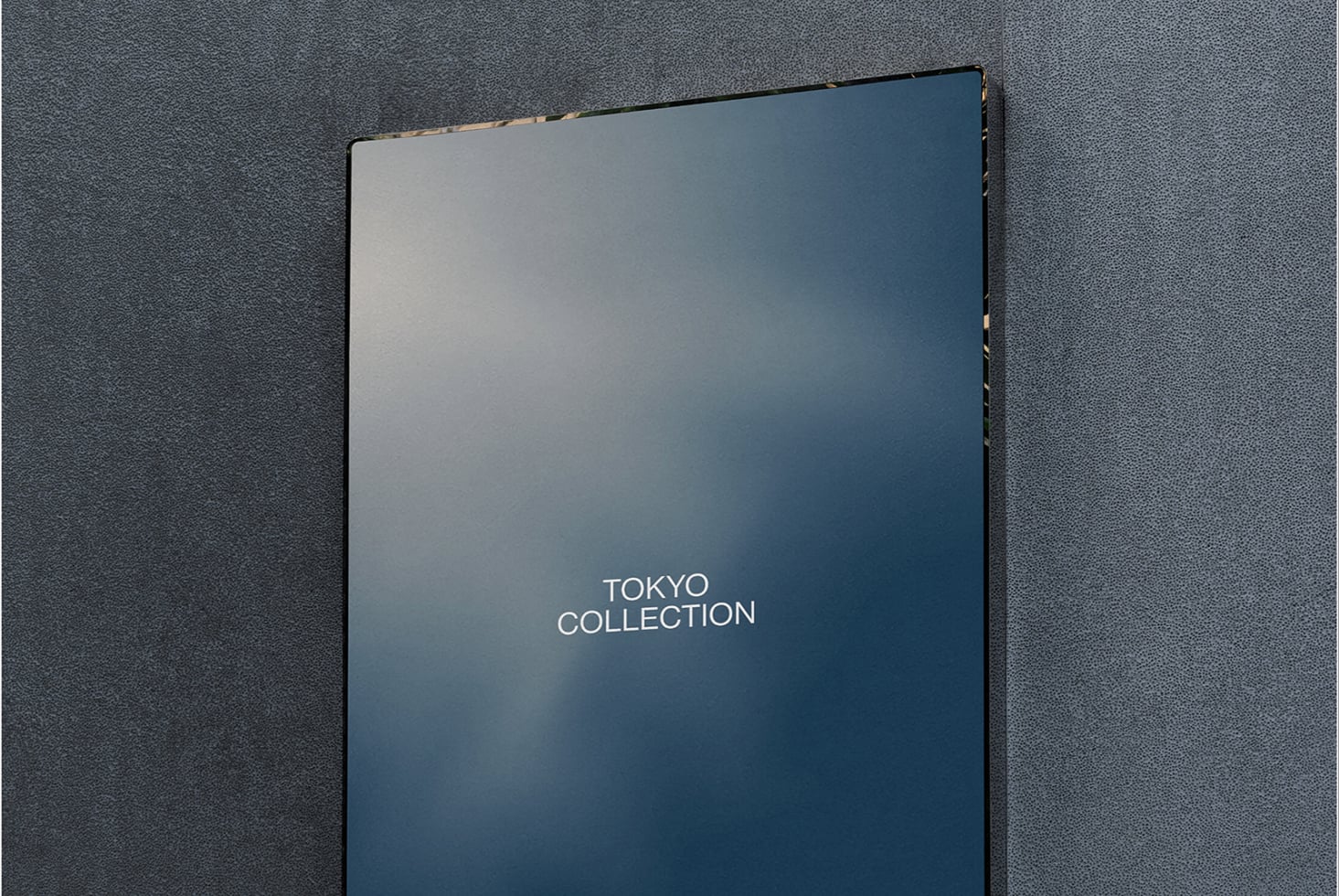 Dark blue book cover mockup with Tokyo Collection text on textured gray background