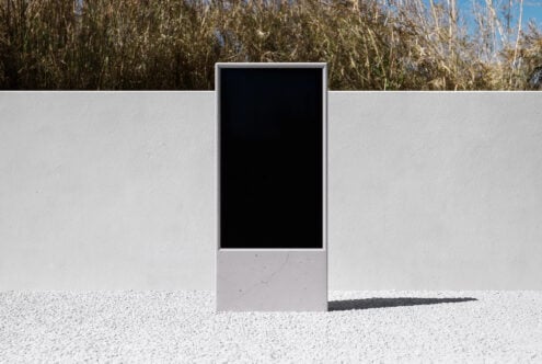 Outdoor portrait screen mockup with black display against dry field